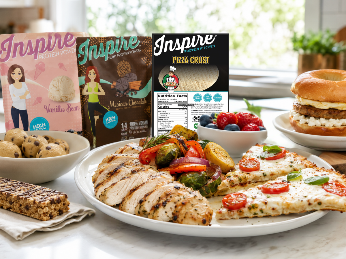 Bright kitchen scene with high-protein bariatric-friendly foods, including grilled chicken, vegetables, pizza, bagel sandwich, snacks, and protein products, styled in natural daylight.
