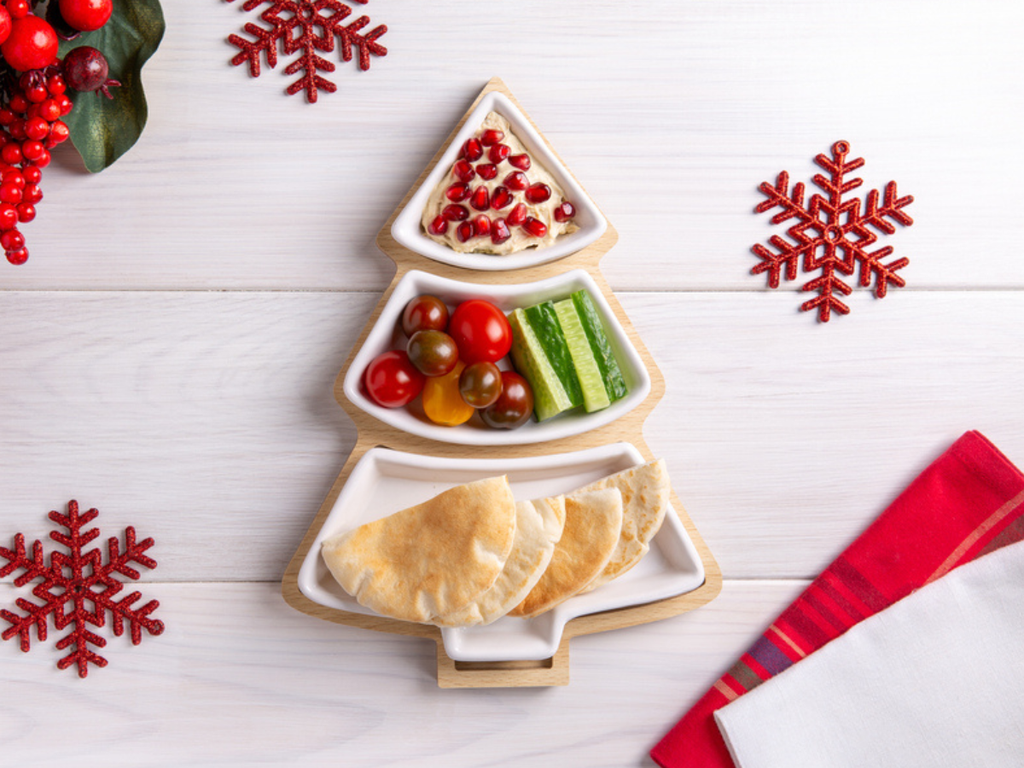 Holiday table with balanced meals and festive treats, illustrating mindful eating during Christmas week