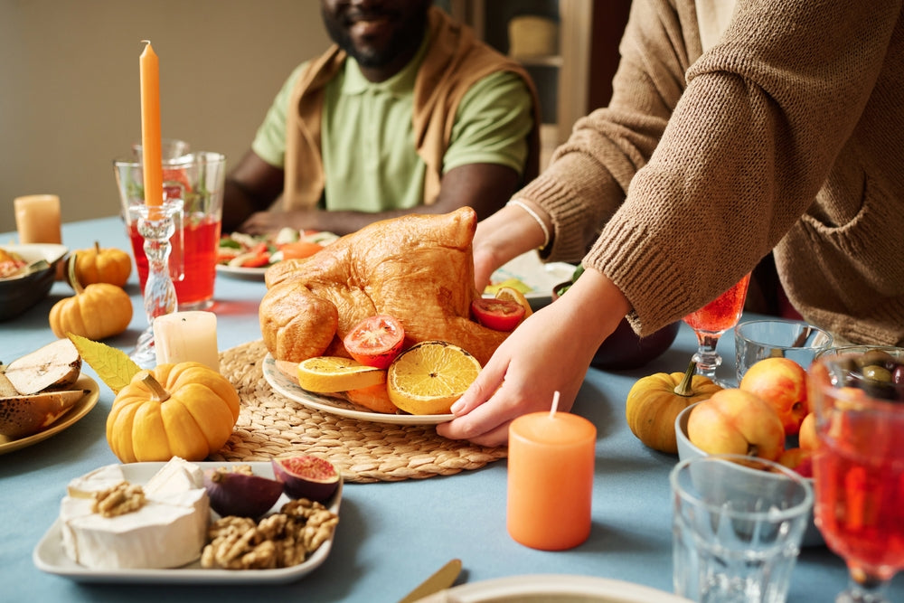 A cozy Thanksgiving table setting with a small plate of healthy holiday food, a warm coffee mug, and a calm, reflective atmosphere symbolizing mindful eating and self-trust.